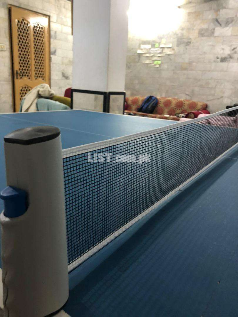Table tennis / pingpong table with new rackets and net