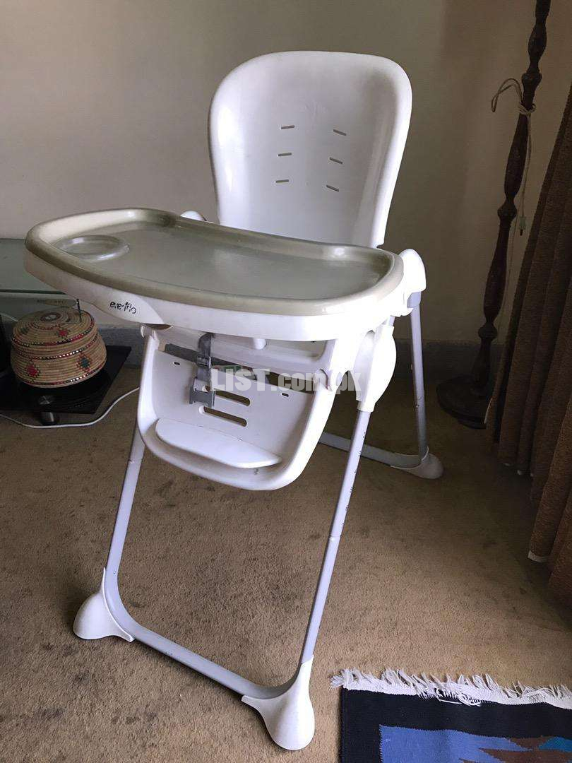 Evenflo genuine imported high chair , reclines , slides up 7x ,