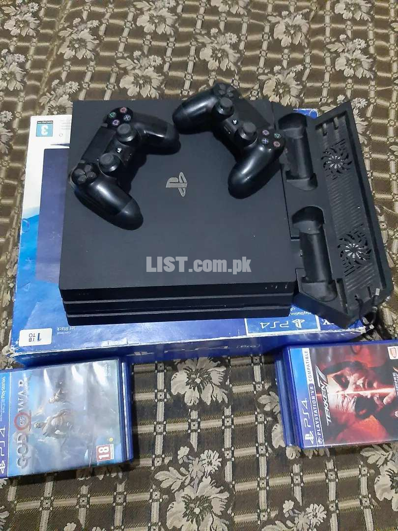 Playstation 4 pro with 2 original controllers and vertical stand