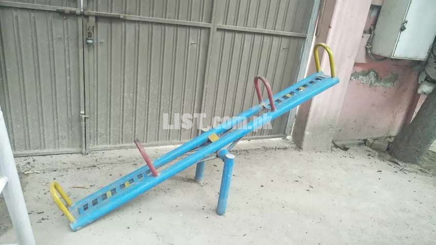 See saw And slide medium size.  Almost new