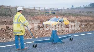 Traveling Beam Device to check irregularities of Road Surface