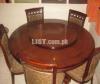Wooden dining table with centre revolving