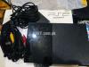Playstation 2 with 12 games and game bag