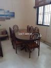 Glass top dining table with 8 chairs
