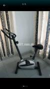 Magnetic exercise cycling machine